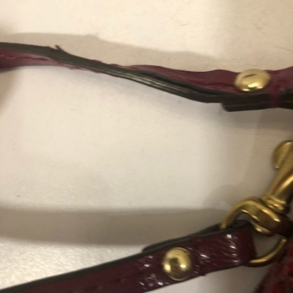 Coach pink python embossed wristlet bag